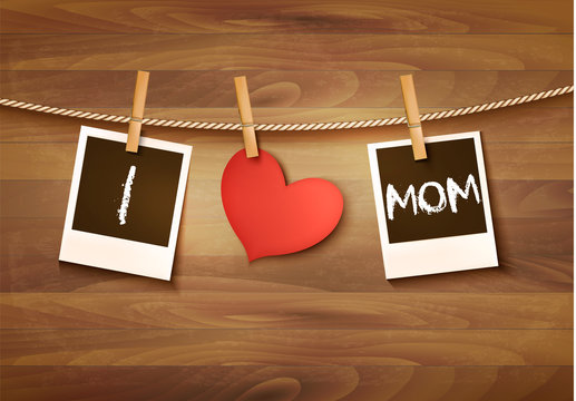 Photos hanging on a clothesline, spelling out I love mom. Mother