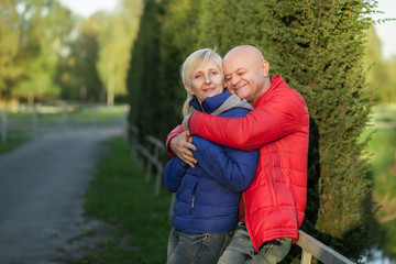 happy seniors couple embrace and smile;