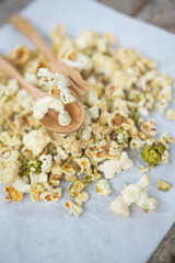 Salt popcorn on the wooden table, selective focus