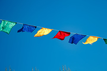 Colorful bunting flags on blue sky
