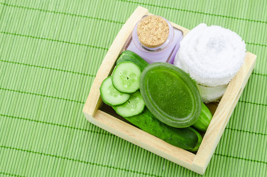 shampoo bottle with cucumber and towel