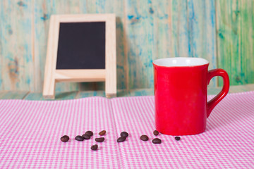 coffee beans with red cup