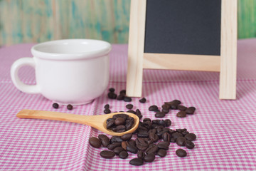 coffee beans and menu board on the wooden table