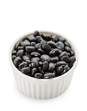 black bean seeds in white bowl.