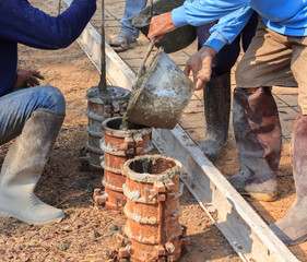 Workers are cement castings for strength testing