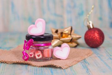 candies sweets heart in bottle on table