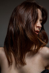 Fototapeta premium Closeup of a freckled woman, disheveled