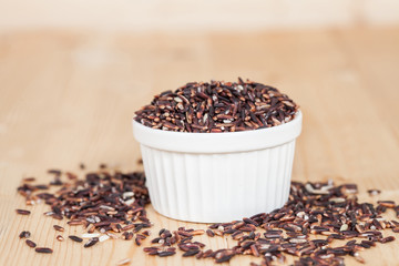 raw Rice berry on wood background