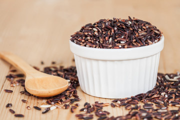 raw Rice berry on wood background
