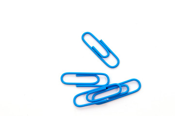 Blue paper clip on white background