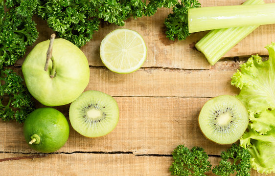 Green Fruits And Vegetables On Old Wood