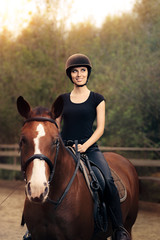 Happy Horsewoman Ridding  in a Manege