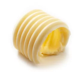 Crédence de cuisine en verre imprimé Produits laitiers butter curl on white background