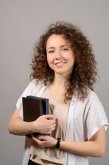 young beautiful student with books