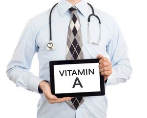 Doctor holding tablet - Vitamin A