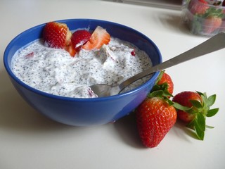 bowl of a yoghurt with strawberries