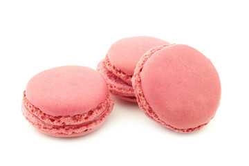 colorful freshly baked macarons on a white background