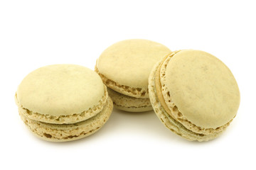 colorful freshly baked macarons on a white background