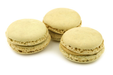 colorful freshly baked macarons on a white background