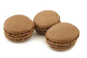 colorful freshly baked macarons on a white background