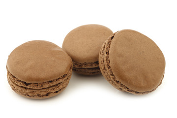 colorful freshly baked macarons on a white background