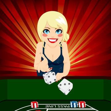 Attractive young blonde woman on casino playing craps throwing dice