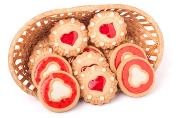 cookies with jelly in wicker basket isolated on white background