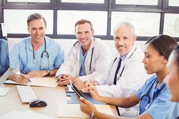 Fototapeta premium Portrait of doctors smiling in conference room