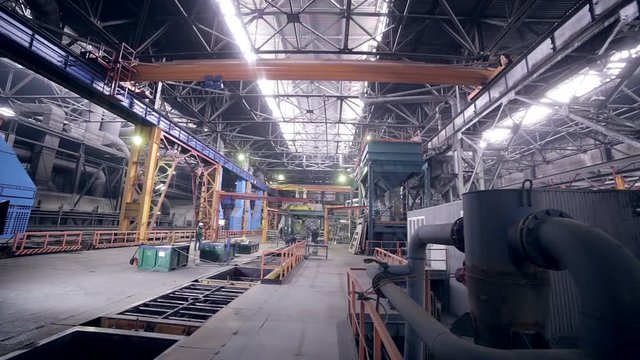 Automated robotics welding line at a heavy industry plant. HD.