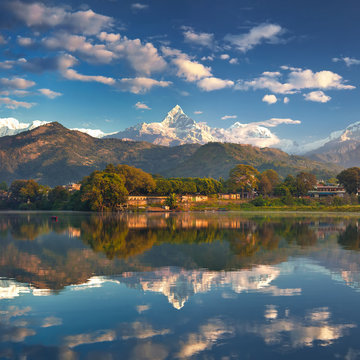 Panoramic view from the lakeside at the foothills of the magnificent mountain range.