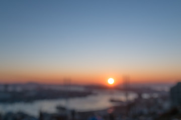 Fototapeta premium Blurred city view during sunset.