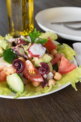 Healthy salad with Octopus and vegetables