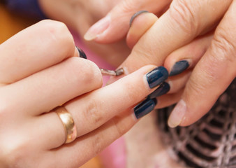 Obraz na płótnie Canvas build artificial nails, manicures, artificial nails correction,
