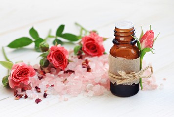 Obraz na płótnie Canvas Essential rose oil, scented rosy bath sea salt. Aromatic bath blend.