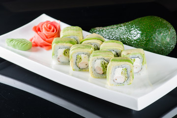 Set of traditional japanese food sushi on a dark background