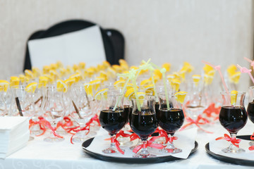 White table set for dinner with empty wineglasses