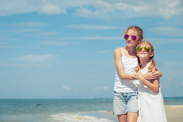 Happy children playing on the beach at the day time.