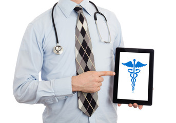 Doctor holding tablet - Caduceus symbol