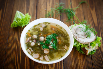 vegetable soup with sausages in a plate