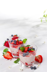 Yogurt with granola or muesli and berries
