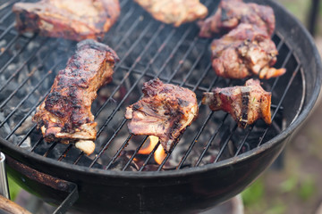 Cooking grilled red meat on barbeque