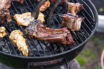 Cooking grilled red meat on barbeque
