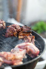 Cooking grilled red meat on barbeque