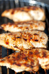 Grilled chicken breast on barbeque