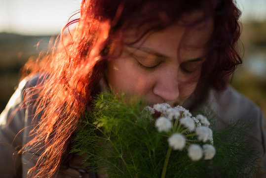 Adult Woman Smelling Bouquet Flowers