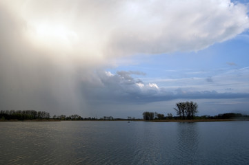 Fototapeta na wymiar Rain clouds over lake