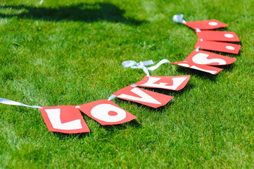 Garland with signs Love is letters
