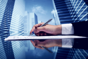 Businessman signing a document