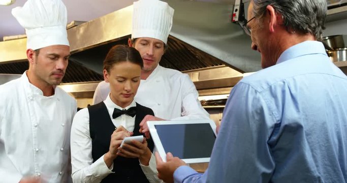 Man giving instructions to the chefs