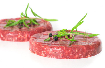 Raw beef hambuger isolated on white background